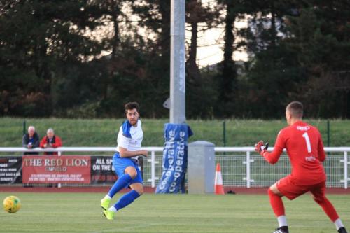 Enfields James Potton passes to a teammate in the centre of the penalty area