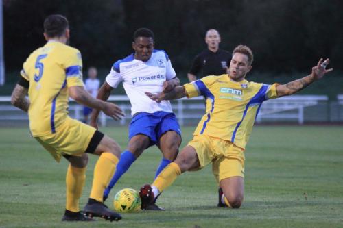 Enfields Jon Muleba and Stortfords Sam Robbins (5) and Ryan Henshaw