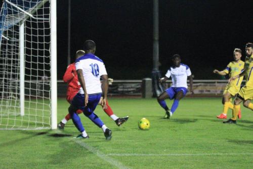 Enfields Ken Charles (10) tries to pick out Junior Mubiayi but the ball is cleared by ome od the Stortford defenders