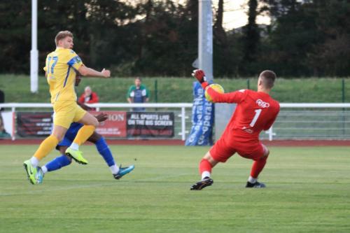 Stortford keeper Fred Burbidge saves from Ken Charles but Charles scores from the rebound