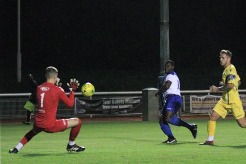 Stortfords Fred Burbidge saves from AlexCathline but the rebound falls to Junior Mubiayi for the final goal