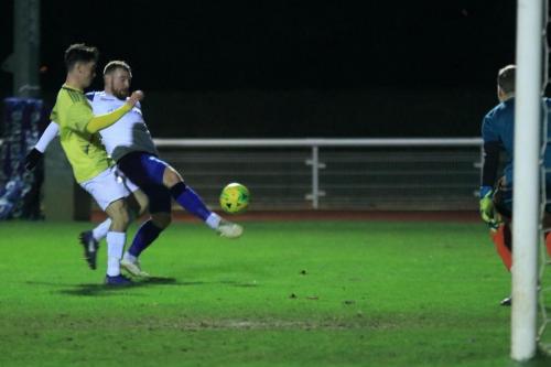 Enfields Billy Bricknell gets a shot away despite the attentions of Joe Wilson