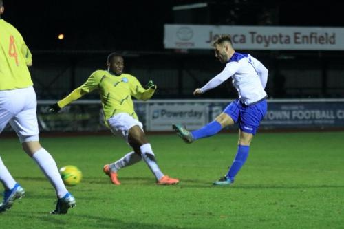 Enfields Jack Hockney shoots as Jean-Luc Kinsaba tries to block