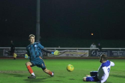 Staines keeper Jacob Adams saves from Billy Bricknell
