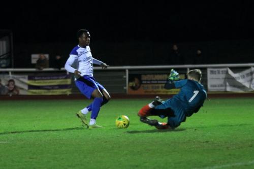 Staines keeper Jacob Adams saves from Ken Charles