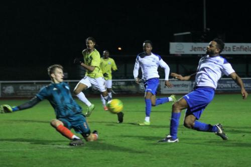 Staines keeper Jacob Adams saves from Kezie Ibe