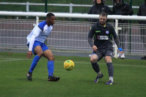 Enfields Jon Muleba (L) and Thatchams Kyle Tooze