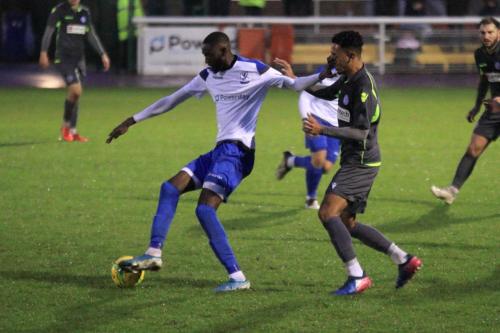 Enfields Muhammadu Faal (L) holds off Jordan Williams