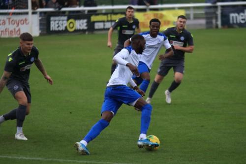 Enfields Muhammadu Faal (white, front) and Samson Esan and Thatchams Matt Partridge (L)
