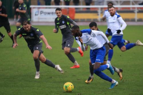 Enfields Muhammadu Faal chased by Jack Alexander (L), George Jeacock and Felipe Barcelos