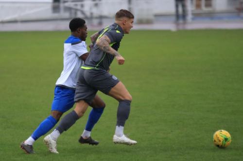 Enfields Samson Esan (L) and Thatchams Matt Partridge