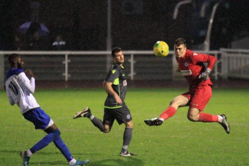 Thatcham keeper Archie Matthews clears from Muhammadu Faal