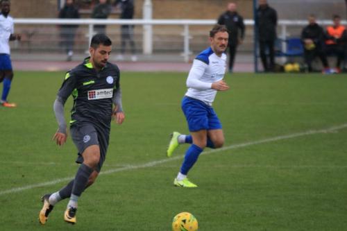 Thatchams Felipe Barcelos (L) and Enfields Scott Thomas