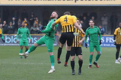 Enfield's Billy Bricknell (L) challenges Matt Newman