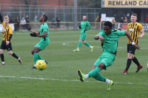 Enfield's Ken Charles shoots but is flagged offside.