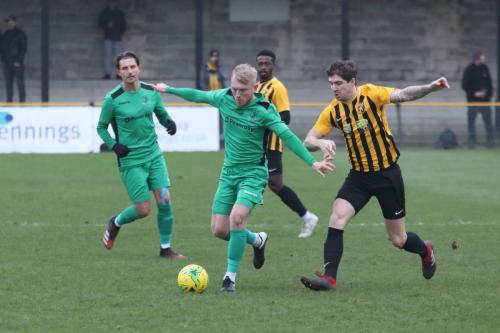 Enfield's Ryan Blackman and Sanm Youngs (L) and Fokestone's Matt Newman (R) and Ira Jackson