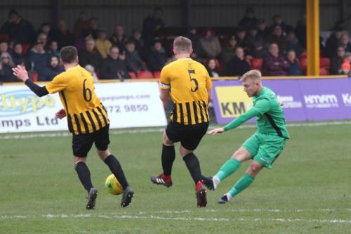 Enfield's Ryan Blackman misses Callum Davies (5) with his shot but hits Ian Draycott (6)