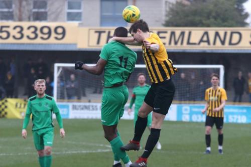 Folkestone's Matt Newman (R) and Enfield's Shaun Okojie
