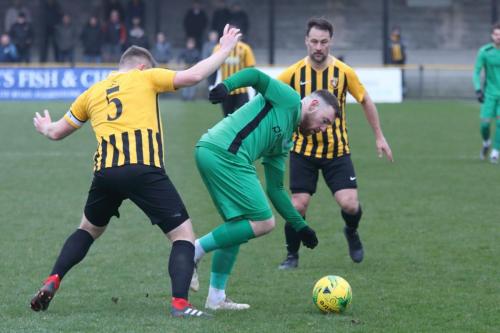 Folkestones Callum Davies (L) and Micheal Everitt and Enfields Billy Bricknell