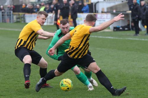 Folkestones Callum Davies (L) ands Josh Vincent and Enfields Billy Bricknell
