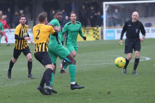 Folkestones Josh Vincent (2) and Enfield Shaun Okojie