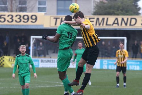 Folkestones Matt Newman (R) and Enfields Shaun Okojie
