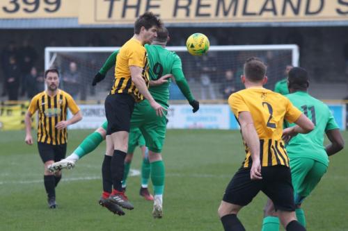 Folkestones Matt Newman (amber black) challenges Billy Bricknell