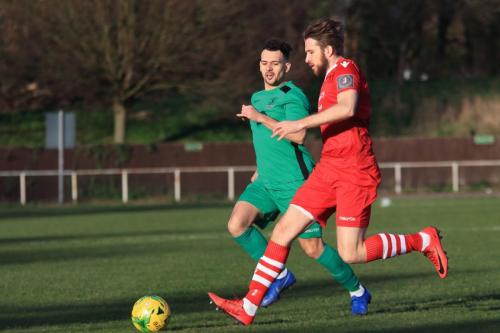 Enfields Lyle Della-Verde (L) and Hornchurchs Remi Sutton