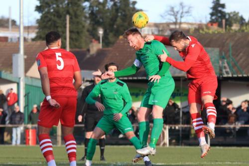 Enfields Marc Weatherstone (2nd R) heads just off target