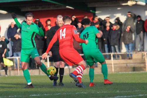 Enfields Sam Youngs (L) and Nathan Livings and Hornchurchs  Jordan Clark