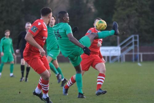 Enfields Shaun Okojie and Hornchurchs Nathan Cooper (L) and Chris Dickson