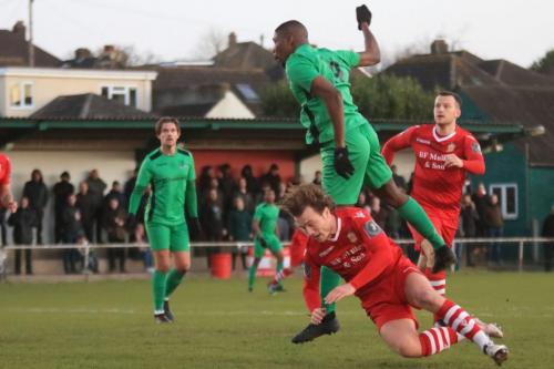 Enfields Shaun Okojie wins a header against Mickey Parcell