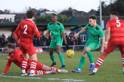 Hornchurchs Arthur Lee (on ground) blocks Lyle Della-Verdes (2nd R) shot