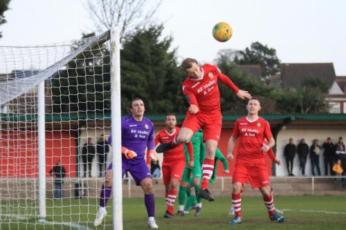 Hornchurchs George Winn heads clear