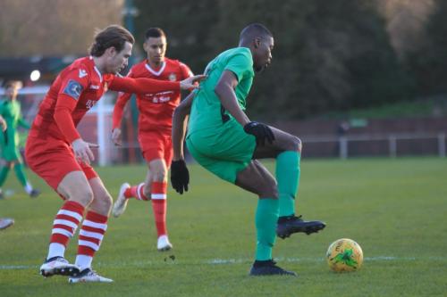 Hornchurchs Mickey Parcell (L) and George Saunders and Enfields Shaun Okojie