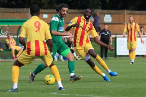 Enfields Muhammadu Faal plays the ball past Daniel Gallagher to Ken Charles (9)
