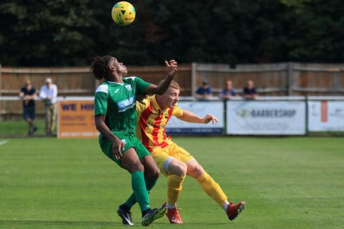 Leatherheads Izunna Ikebuasi (L) and Enfields Sam Bantick