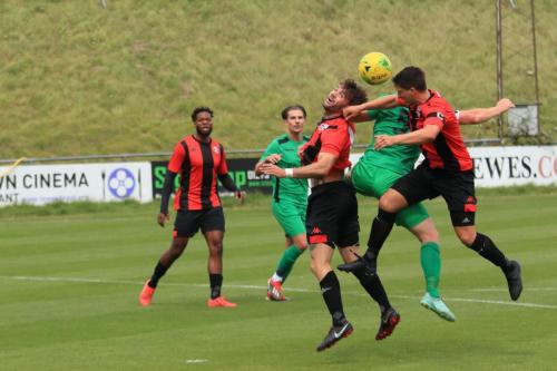 Enfields Marc Weatherstone (green) is challenged by Frankie Chappell (R) and Stacey Freeman