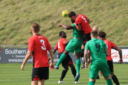 Lewes Frankie Chappell (5) heads clear from Alex Cathline