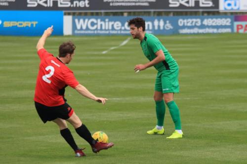 Lewes Kieron Pamment (L) clears from James Potton
