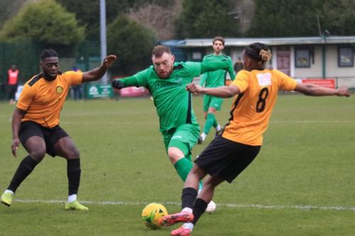 Enfields Billy Bricknell and Mersthams Calvin Ekpiteta (L) and Oshane Stewart