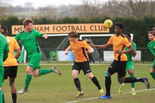 Enfields Marc Weatherstone heads across the face of the Merstham goal