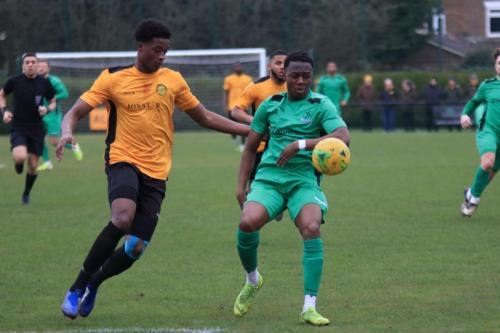 Mersthams Emmanuel Fernandez (L) and Enfields Ken Charles