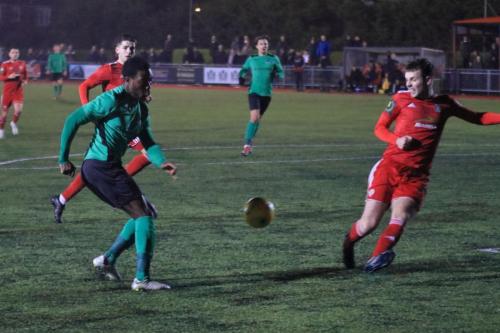 Enfields Samson Esan (L) and Worthings Alfie Young