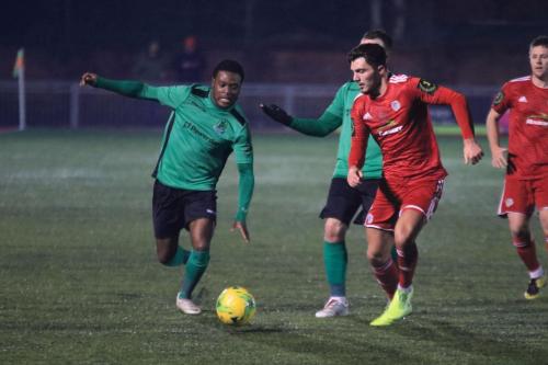 Enfields Samson Esan (L) and Worthings Jesse Starkey