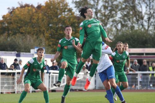 Leatherhead's Joe Leslie (green, 2nd R) heads clear from Sam Youngs watched by Will Seager (L), Craig McGee and Will Salmon (R)
