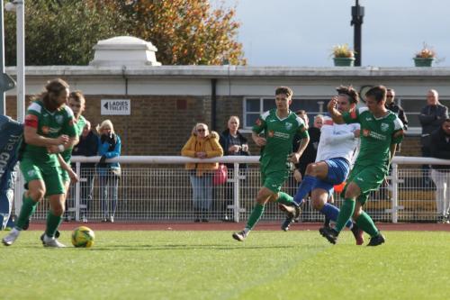 Leatherhead's Will Salmon (L) blocks a shot from Sam Youngs