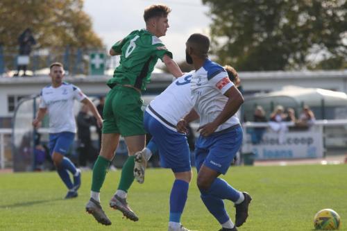 Leatherhead's Will Seager (6) wins a header against Billy Bricknell
