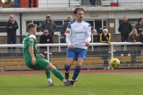 Leatherhead's Will Seager (L) clears from Sam Youngs