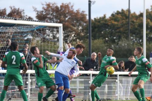 Panic in the Leatherhead defence as Enfield's Billy Bricknell (white, front) and Marc Weatherstone challenge for the ball